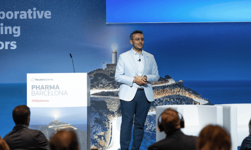 A speaker addressing the audience from the main stage