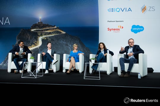 Panellists in discussion on stage at a Reuters Events conference